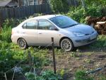 Автомобиль Toyota Prius - хэтчбек фото